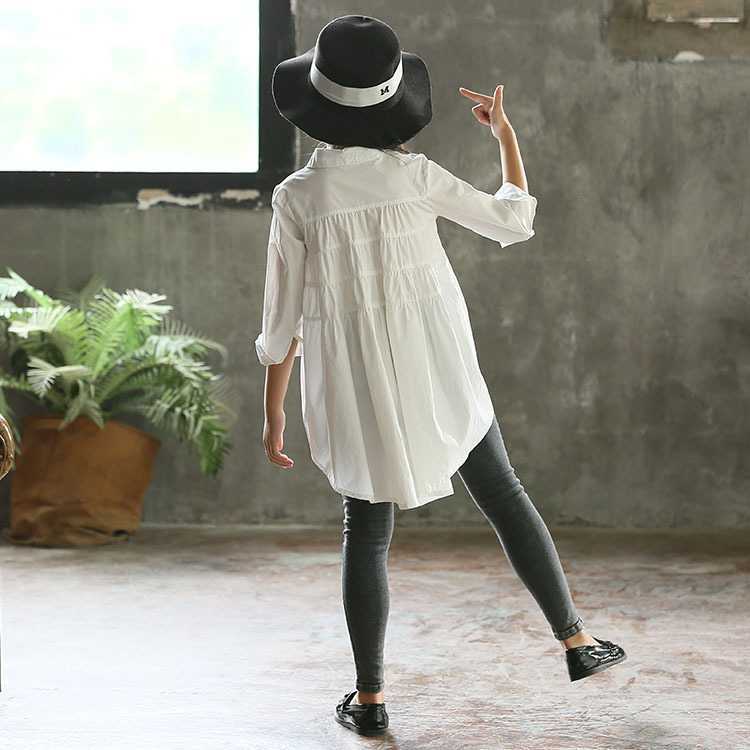 Girls' big kids loose fashionable Korean style tops with swallowtail design, by Ancient Energy, shown on a model.
