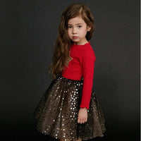 Girls' dress by Ancient Energy, featuring a colorful floral pattern and lightweight fabric perfect for warm weather.