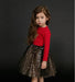 Girls' dress by Ancient Energy, featuring a colorful floral pattern and lightweight fabric perfect for warm weather.