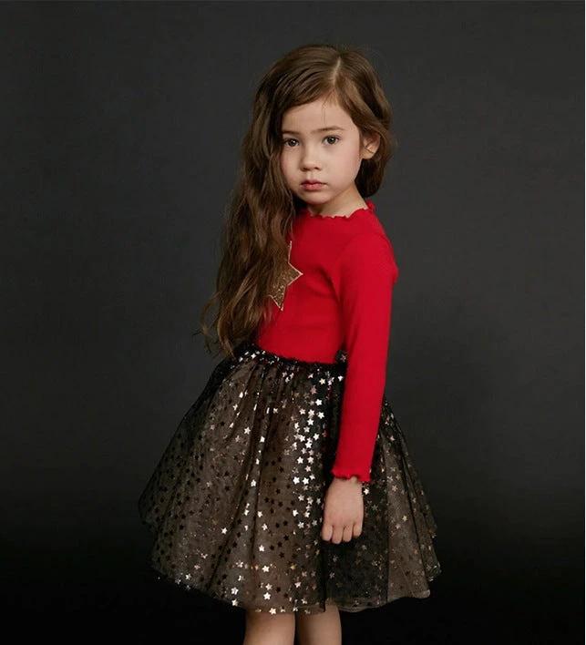 Girls' dress by Ancient Energy, featuring a colorful floral pattern and lightweight fabric perfect for warm weather.