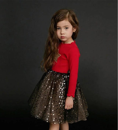 Girls' dress by Ancient Energy, featuring a colorful floral pattern and lightweight fabric perfect for warm weather.