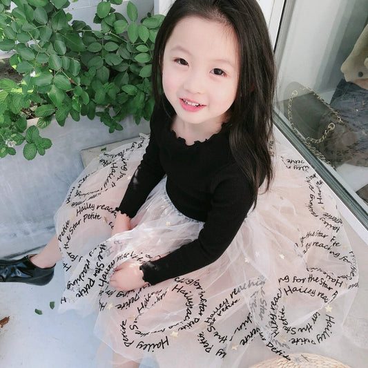 Girls' dress by Ancient Energy in soft pastel with floral pattern, sleeveless design, and ruffled hem for a charming look.