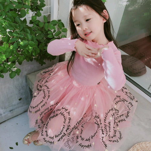 Girls' dress from Ancient Energy, featuring a colorful, patterned design perfect for casual wear and playtime.