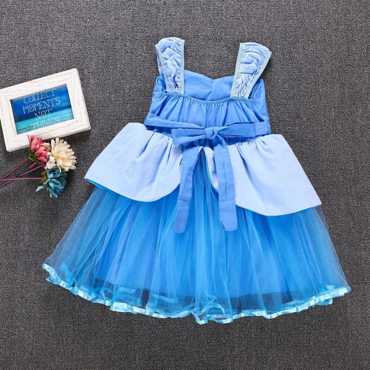 Girls' dress by Ancient Energy, featuring a stylish design suitable for young girls, displayed in a vibrant, colorful fabric.