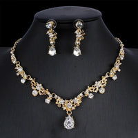Golden zircon bridal jewelry set with matching necklace and earrings, featuring elegant design for wedding and special occasions.