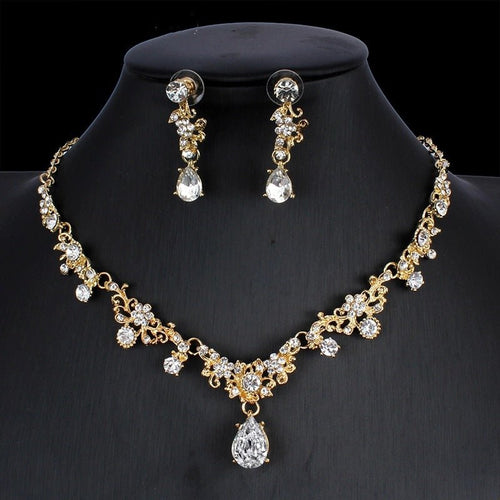 Golden zircon bridal jewelry set with matching necklace and earrings, featuring elegant design for wedding and special occasions.