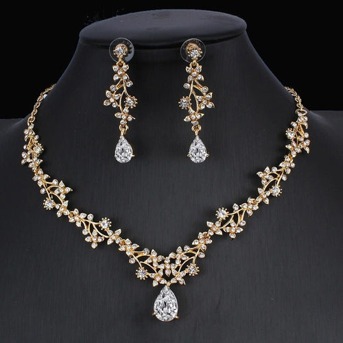 Golden zircon bridal jewelry set with matching necklace and earrings, featuring elegant design for wedding or special occasions.