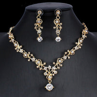 Golden zircon bridal jewelry set featuring a necklace and matching earrings by Ancient Energy for wedding occasions.