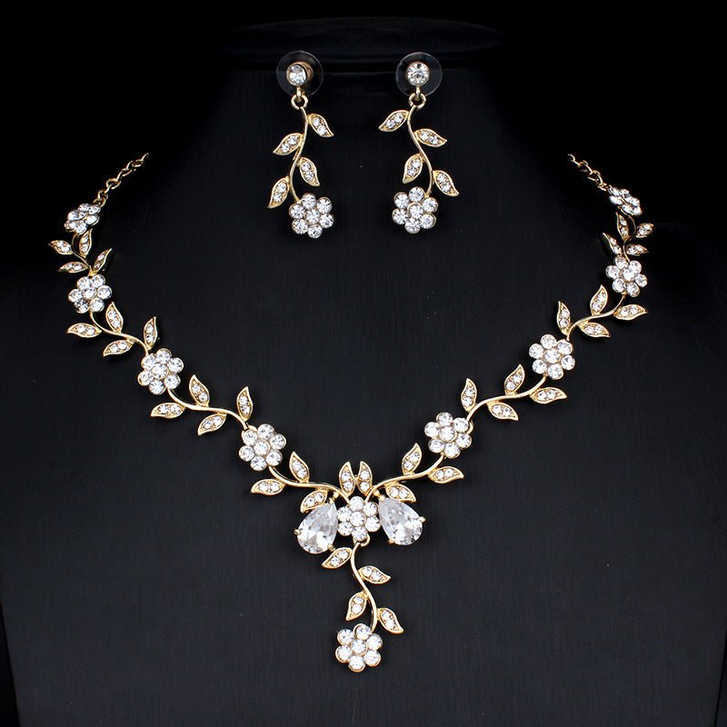 Golden zircon bridal jewelry set with matching necklace and earrings, featuring elegant design for wedding or special occasions.