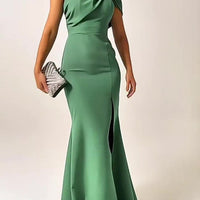 Green bow-tie tube top evening dress by Ancient Energy, featuring a fitted style and elegant design for formal occasions.