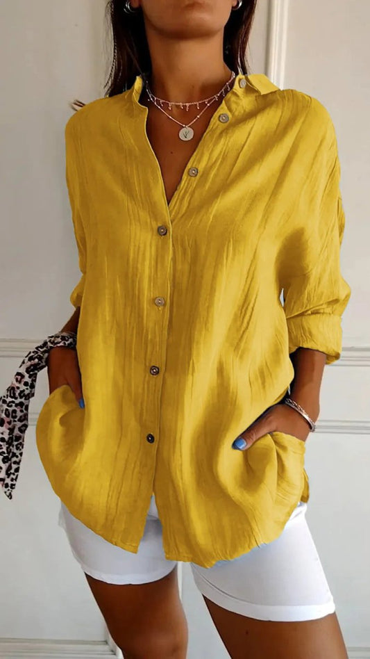Ancient Energy women's lapel long sleeve shirt with single-breasted design and pleated front, stylish and versatile top.