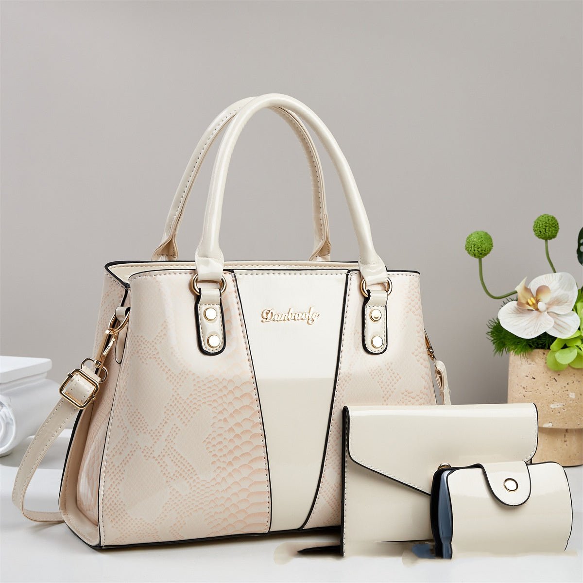 Large-capacity Ancient Energy shoulder and crossbody bag with stylish snakeskin pattern and tote design.