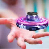 Ancient Energy LED UFO flying helicopter spinner toy for kids, with colorful lights and spinning propeller design.