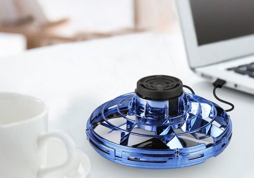Ancient Energy LED UFO flying helicopter spinner toy for kids, featuring colorful lights and spinning motion.