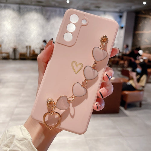 Ancient Energy Love Chain phone case with bronze hollow design, drop-resistant protection, and stylish appearance.