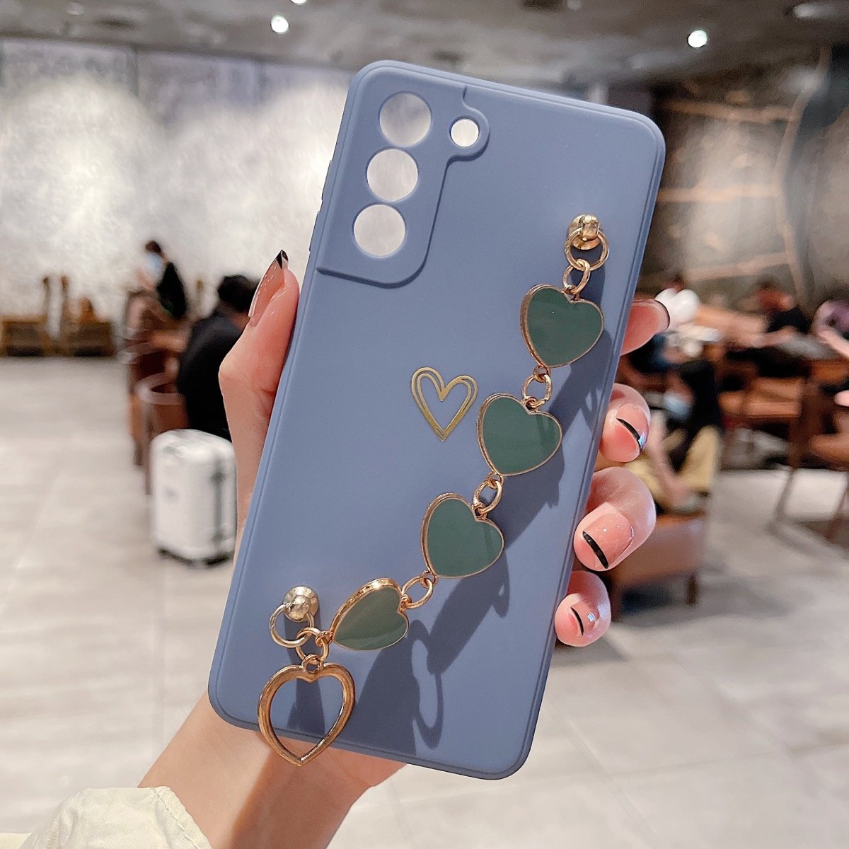 Ancient Energy Love Chain phone case with bronzing hollow design, drop-resistant for iPhone or smartphone protection.