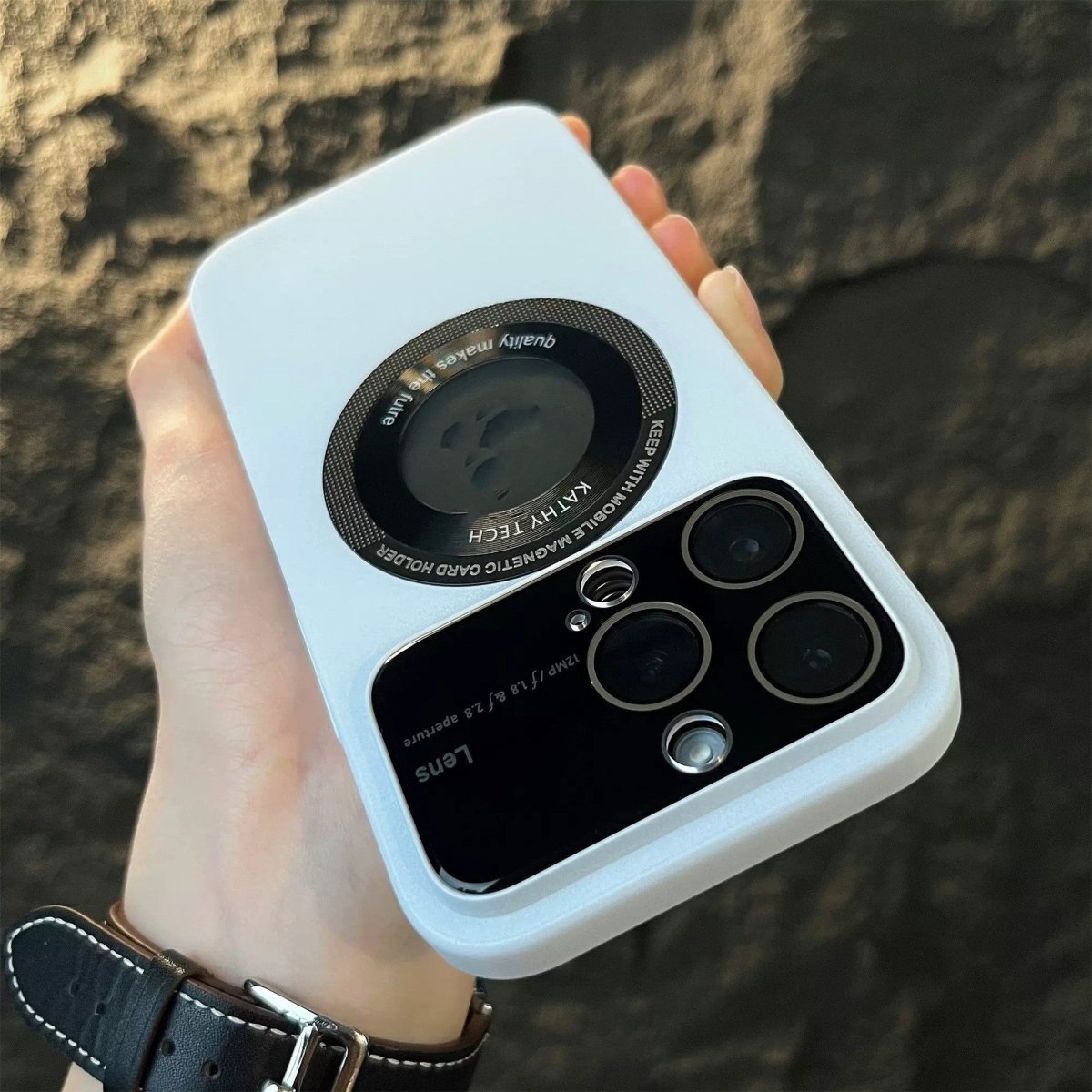 Ancient Energy magnetic suction large window protector phone case attached to a smartphone, showcasing its durable design.