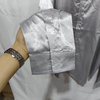 Mens black satin dress shirt by Ancient Energy, close-up of sleek black fabric and classic collar on the stylish shirt.