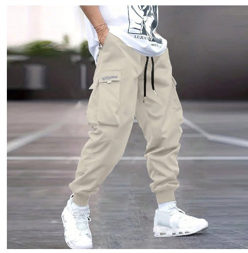 Men's cargo pants by Ancient Energy featuring multiple pockets, casual hip-hop style, drawstring waist, ideal for outdoor streetwear and sport.