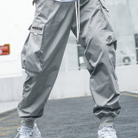 Ancient Energy men's multi-pocket cargo pants featuring drawstring waist, casual streetwear style, suitable for outdoor and sports activities.