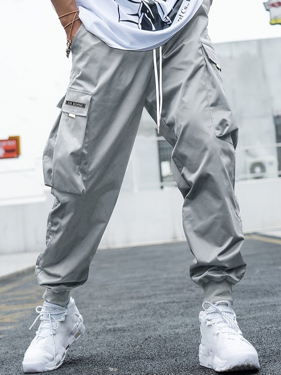 Ancient Energy men's multi-pocket cargo pants featuring drawstring waist, casual streetwear style, suitable for outdoor and sports activities.