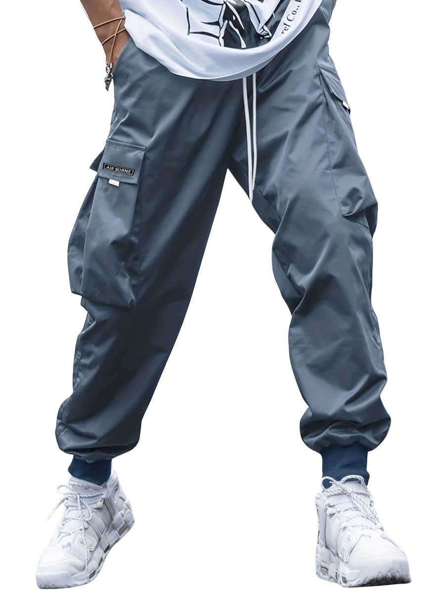 Ancient Energy men's multi-pocket cargo pants featuring drawstring waist, casual streetwear style, suitable for outdoor and sports activities.