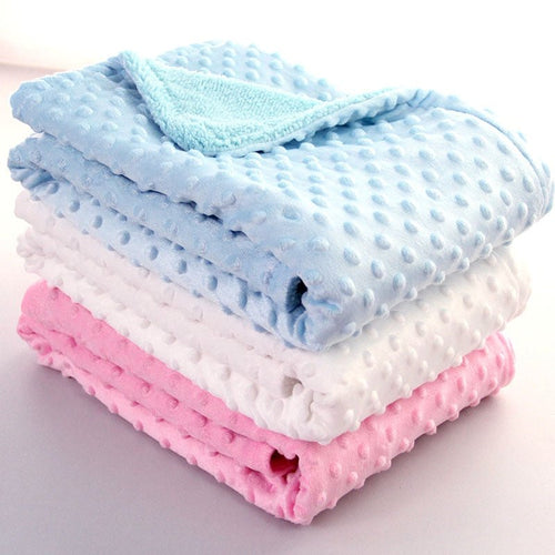 Ancient Energy Polar Dot baby blanket, soft swaddle wrap for newborns, cozy envelope-style bedding for infants.
