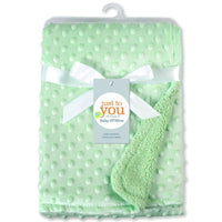 Ancient Energy Polar Dot baby blanket, soft swaddle wrap with polka dots for newborns, cozy bedding for infants.