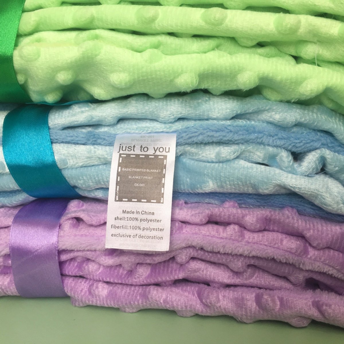 Ancient Energy Polar Dot baby blanket, soft swaddle wrap for newborns, with cute dot pattern and cozy bedding for infants.