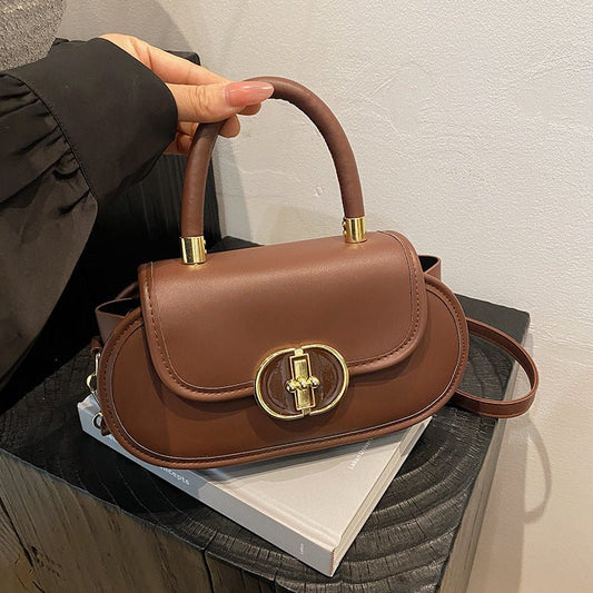 Ancient Energy retro matte tote bag with autumn color accents, designed as a compact crossbody mini round bag.