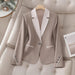 Elegant formal blazer with contrasting color buttons by Ancient Energy, showcasing tailored fit and sophisticated style.