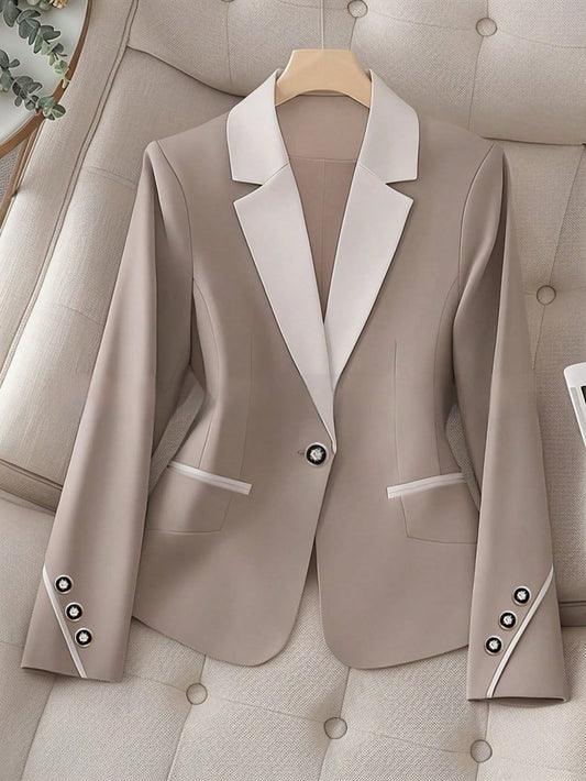 Elegant formal blazer by Ancient Energy featuring contrasting color buttons, tailored fit, and sleek design for professional occasions.