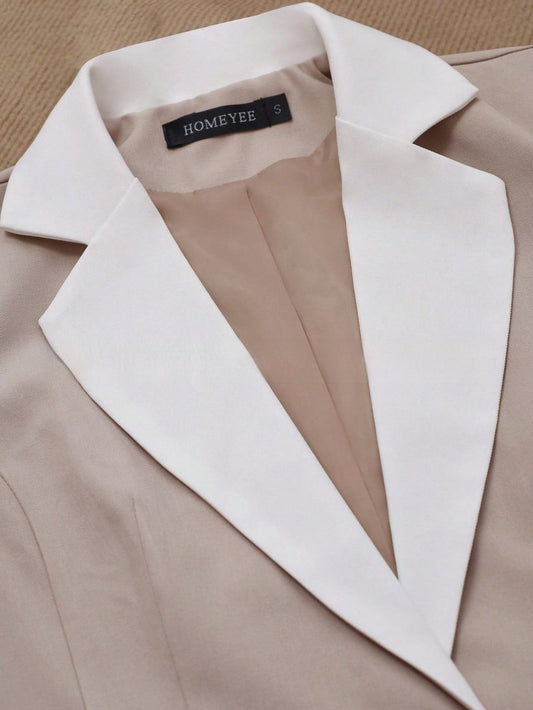Elegant formal blazer by Ancient Energy featuring contrasting color buttons and tailored fit, suitable for professional or dressy occasions.