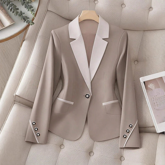 Elegant formal blazer by Ancient Energy featuring contrasting color buttons, tailored fit, and sophisticated design for professional wear.
