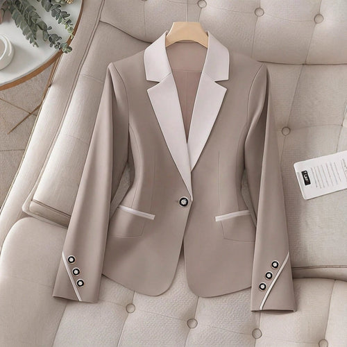 Elegant formal blazer by Ancient Energy with contrasting color buttons, tailored for a sophisticated professional look.