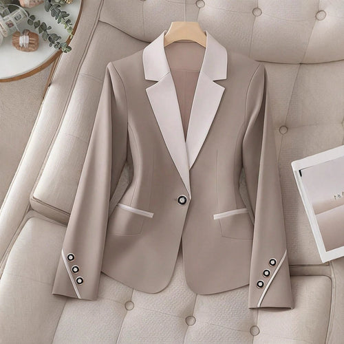 Elegant formal blazer by Ancient Energy featuring contrasting color buttons and a tailored fit for professional or dressy occasions.