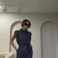 Ancient Energy shoulder slimming waist belt with decorative blouse and pants, showcasing a stylish, fitted outfit.