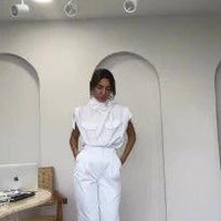 Ancient Energy shoulder slimming waist belt with decorative blouse and pants, showcasing a stylish, fitted outfit.
