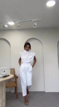 Ancient Energy shoulder slimming waist belt with decorative blouse and pants, showcasing a stylish, fitted outfit.