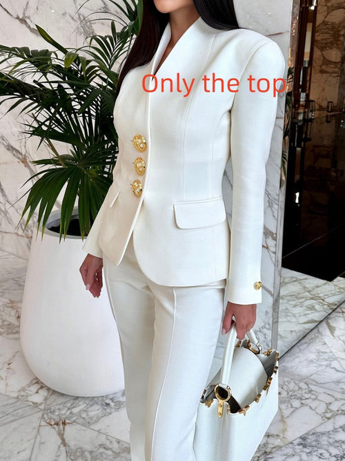 Solid color single-breasted blazer and high-waisted pants set by Ancient Energy, shown on a model, in a stylish, modern fit.