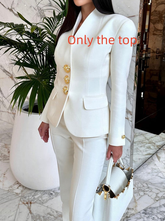 Solid color single-breasted blazer and high-waisted pants set by Ancient Energy, shown on a model, in a stylish, modern fit.