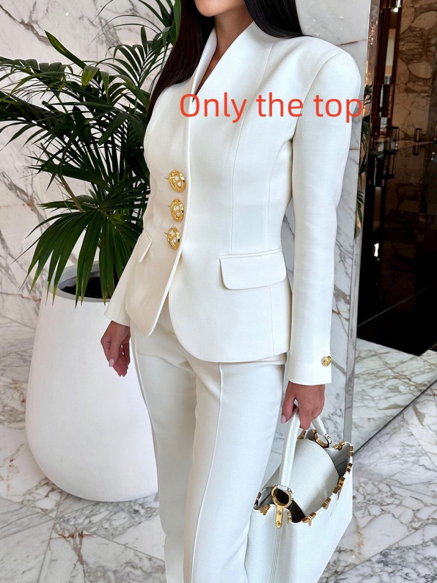 Solid color single-breasted blazer and high-waisted pants set by Ancient Energy, shown on a model, in a stylish, modern fit.