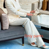 Ancient Energy solid color single-breasted blazer and high-waisted pants set, displayed on a mannequin, front view.