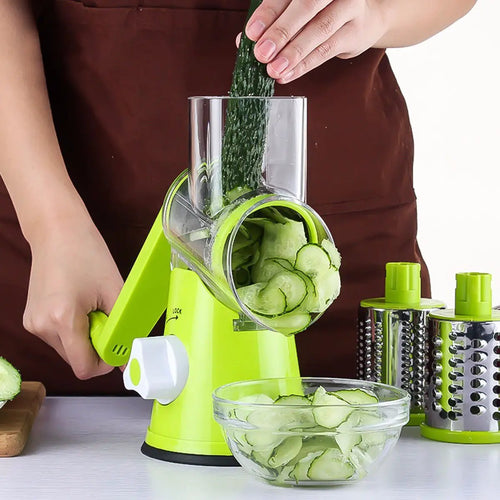 Ancient Energy round vegetable cutter and mandoline slicer with julienne and grater attachments for potatoes, carrots, and cheese.