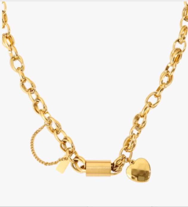 Ancient Energy titanium bracelet with a heart-shaped pendant, featuring a sleek and versatile design for stylish wear.