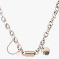 Ancient Energy titanium bracelet featuring a heart-shaped pendant, stylish and versatile jewelry accessory.