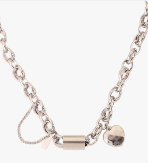 Ancient Energy titanium bracelet featuring a heart-shaped pendant, stylish and versatile jewelry accessory.