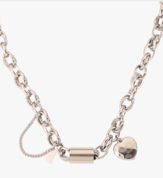 Ancient Energy titanium bracelet featuring a heart-shaped pendant, stylish and versatile jewelry accessory.