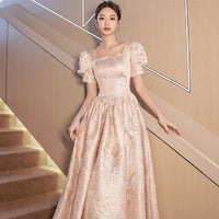 Elegant champagne-colored women evening dress by Ancient Energy, featuring a flowing design and stylish neckline.