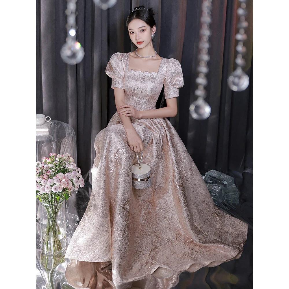 Elegant women’s champagne evening dress by Ancient Energy, featuring a flowing silhouette and stylish design.